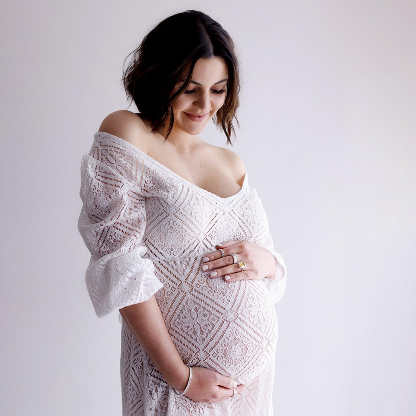 Mum-to-be in a flowing maternity gown at Melissa Larson's Leeming studio, Perth